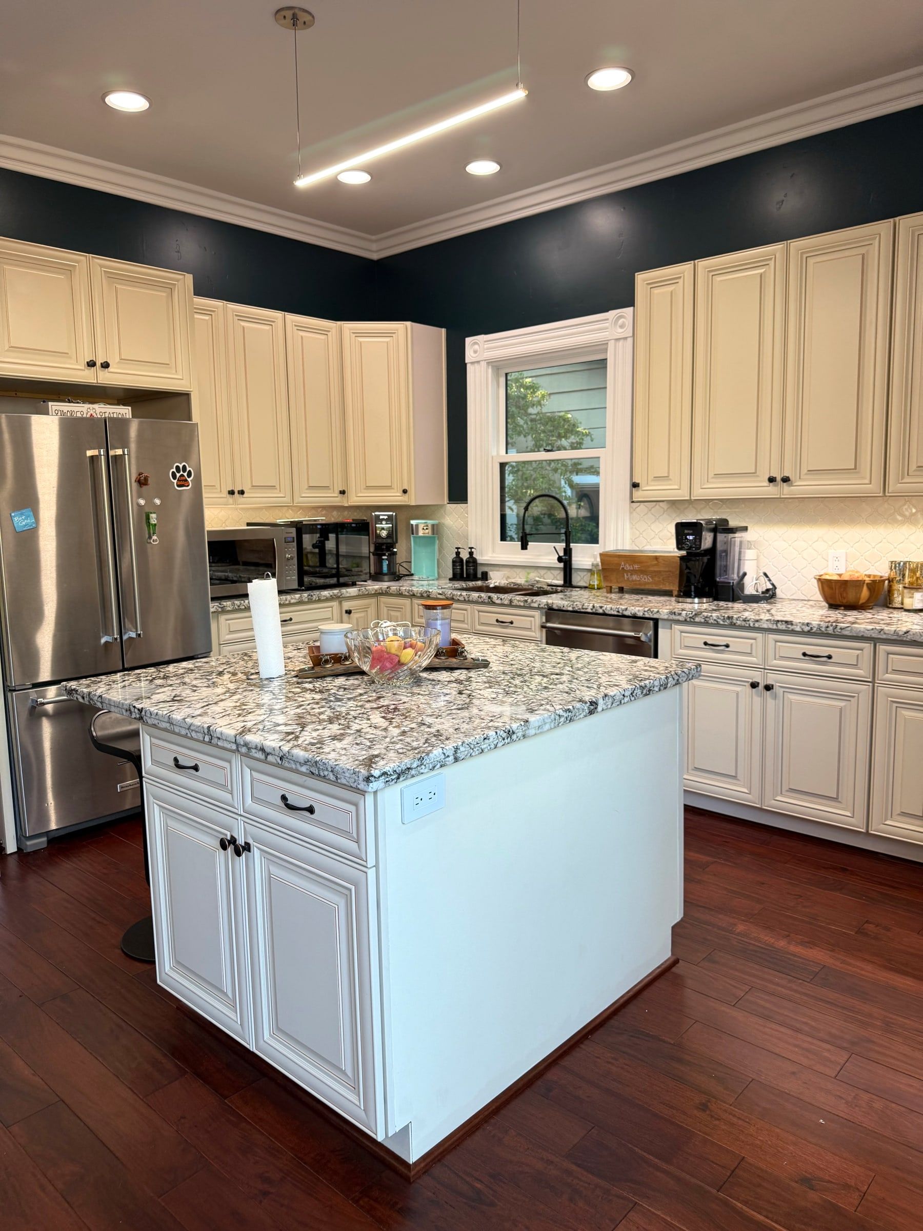 After: The same kitchen unpacked, cleaned and organized with clear counters