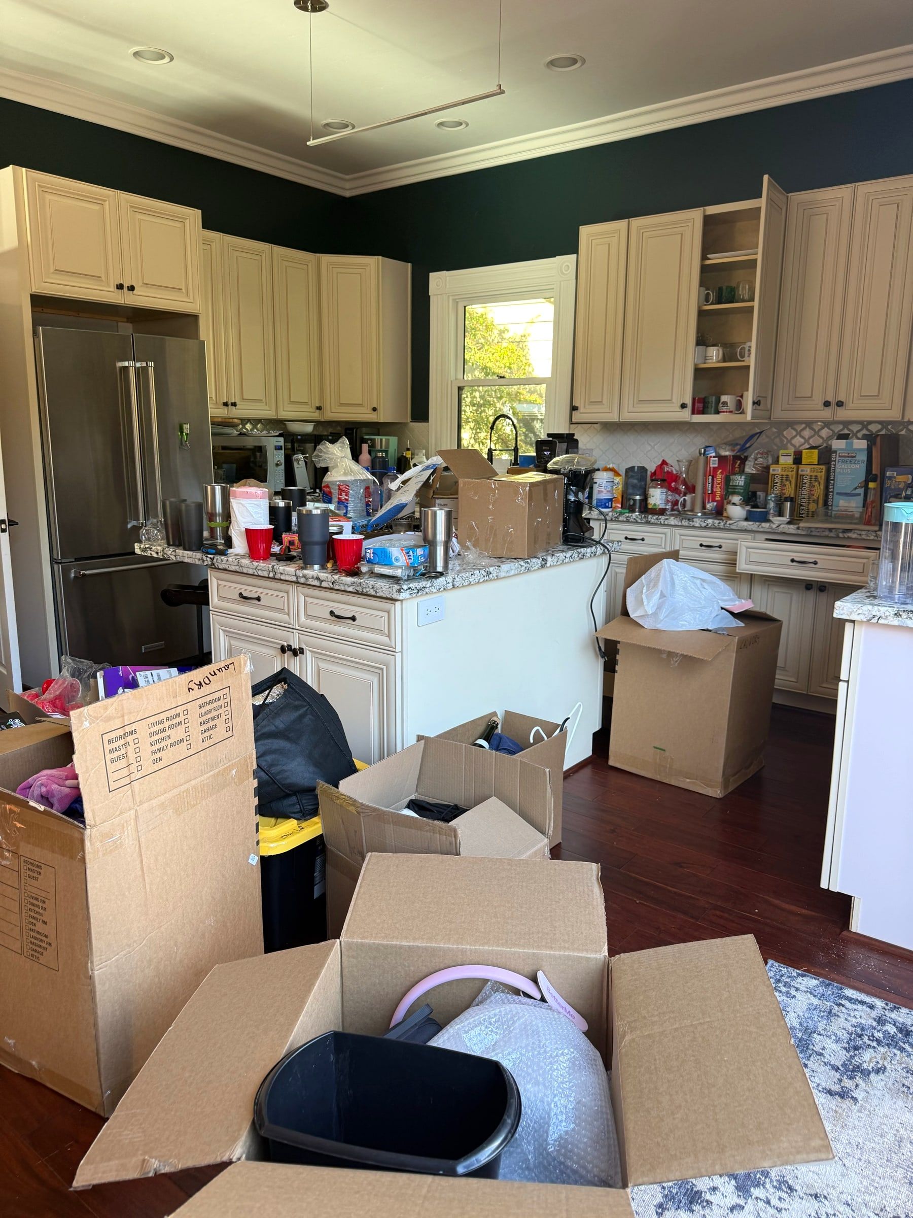 Before: New home kitchen full of moving boxes and unpacked items